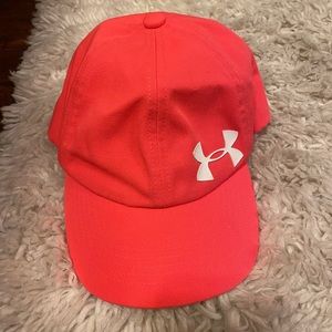 Pink youth size under armour hat, white logo.
